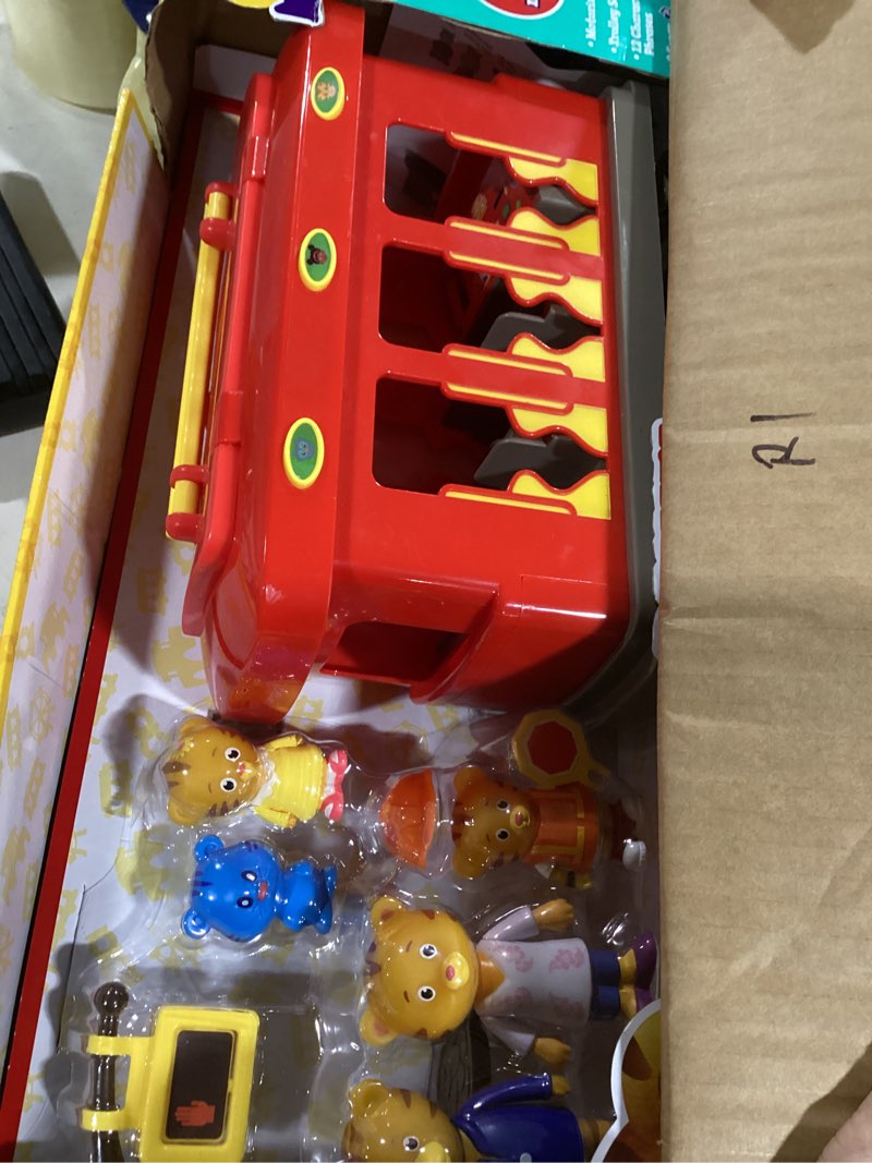 Condition photo showing Good Condition for Deluxe Daniel Tiger's Neighborhood Electronic Trolley Includes 5 Family Figures with Lights, Sounds, Music & Crosswalk Accessories! [Amazon Exclusive]