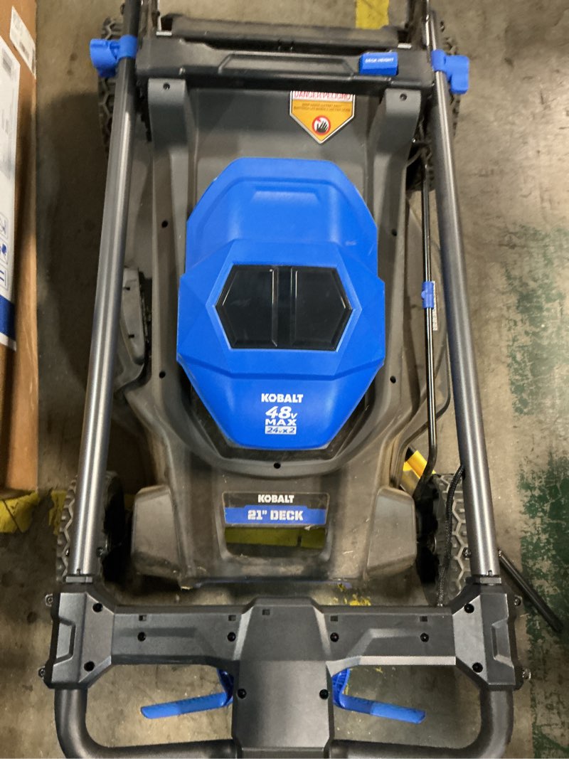 Condition photo showing As Is for kobalt 48v max (24vx2) 21-in push mower kit, (2) 5.0ah batteries and not charger included