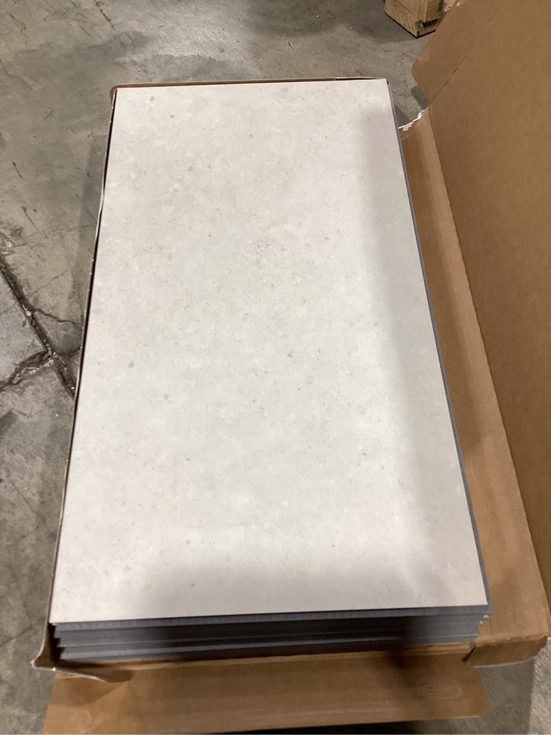 Condition photo showing As Is for pergo marbella limestone 22-mil x 12-in w waterproof stone look luxury vinyl tile flooring