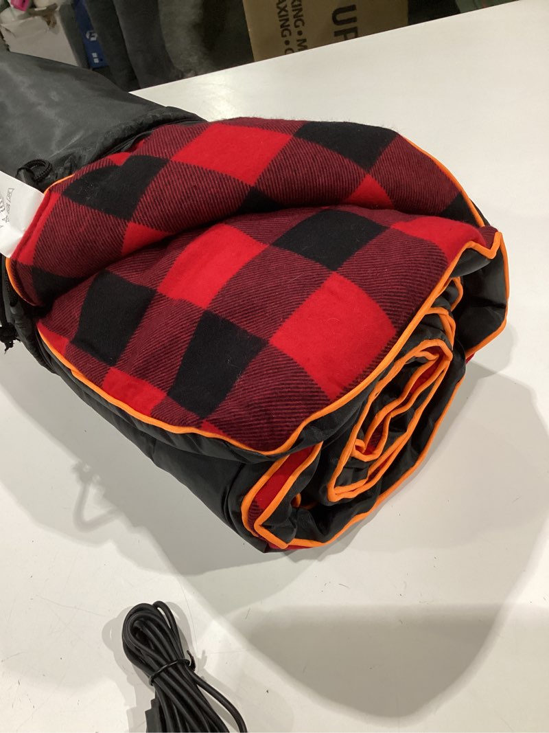 Condition photo showing New/Like New for heated sleeping bag pad, operated by 5v/2a usb power supply (battery not included). black & red flannel.