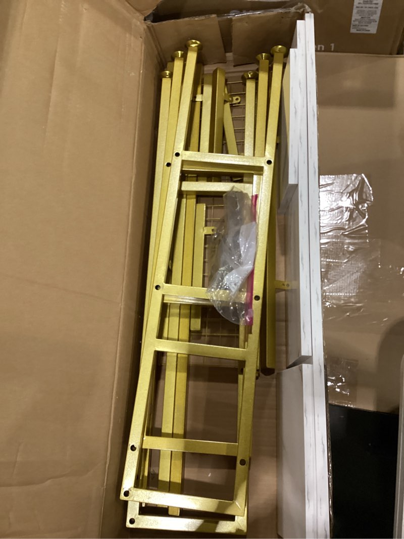 Gold bookcase wih marble shelves *unable to find stock photo