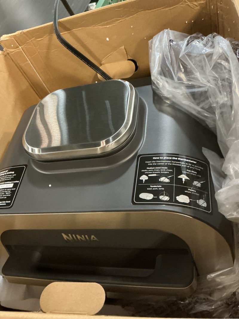 Condition photo showing Good Condition for ninja | indoor grill and air fryer| foodi smart xl | 6-in-1 grill, air fry, roast, bake, broil, dehydrate & crisp |smart thermometer & splatter shield | dishwasher safe parts | black/silver | fg551 6-in-1 with thermometer