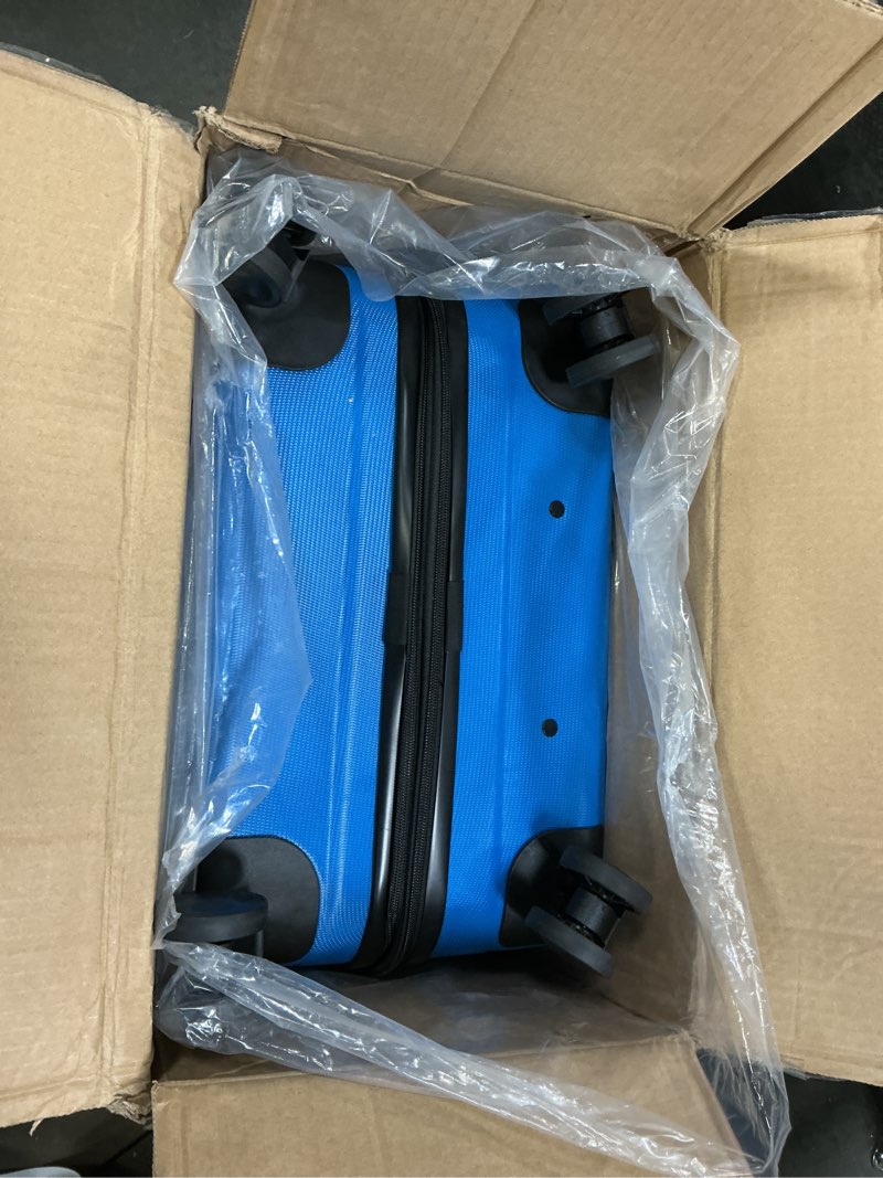 Condition photo showing Good Condition for Amazon Basics 26" Hardside Medium Checked Luggage, Expandable For Up to 15% More Space, With Scratch-Resistant Surface, Four Multi-directional Wheels, Light Blue Light Blue Medium Checked