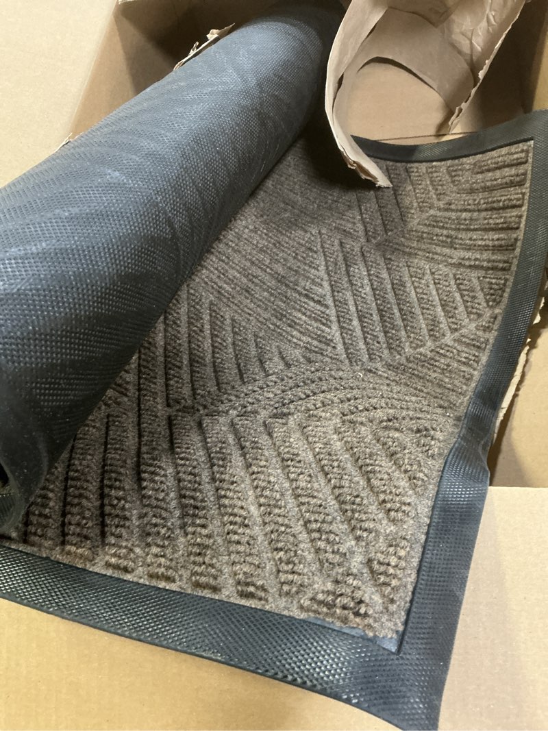 Condition photo showing As Is for Smiry Front Door Mat Outside Entrance, Heavy Duty Sturdy Natural Rubber Doormat, Trap Dirt and Moisture, Easy Clean Low Profile Mats for Indoor Outdoor Entry, Irregular Triangle (36x24, Brown) Brown Irregular Triangle Rectangular 36" x 24"