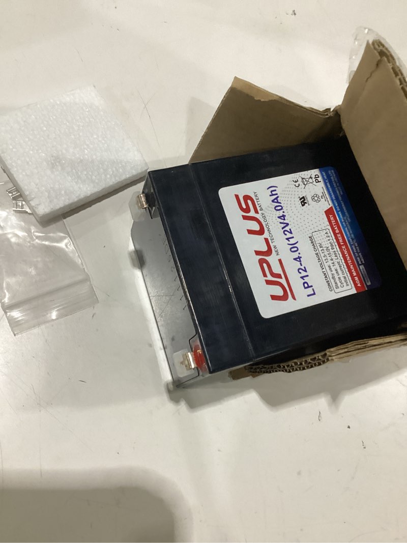 Condition photo showing As Is for uplus 12 volt 4ah rechargeable agm battery, lp12-4 sla alarm battery replacement batteries for security control panel, garage door opener, ion block rockers, ups systems, ride on truck etc.