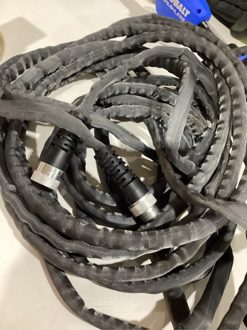 Condition photo showing As Is for water hose