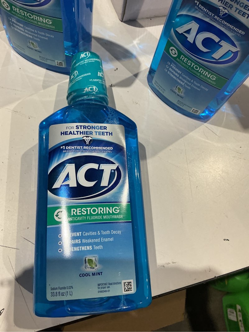 Condition photo showing Good Condition for act restoring fluoride mouthwash 33.8 fl. oz. strengthens tooth enamel, cool mint cool splash mint 33.8 fl oz (pack of 1) (expires 06/2027)