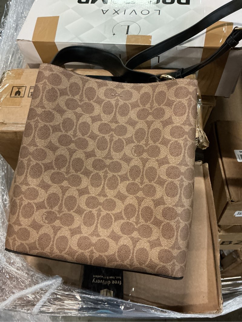 Condition photo showing Good Condition for Coach Town Bucket Bag Medium (L 8.5" x W 4.9" x H 10") Tan/Black