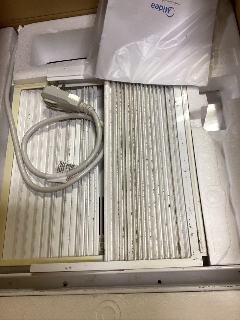 Condition photo showing As Is for midea 12,000 btu remote, cool only inverter window,new energy star, white,smart air conditioner