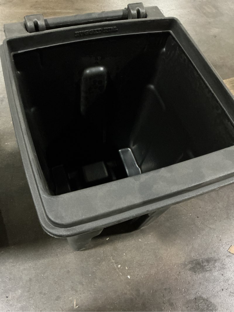 Condition photo showing Good Condition for possibly used toter 32-gallon black plastic wheeled indoor/outdoor hinged lid trash can