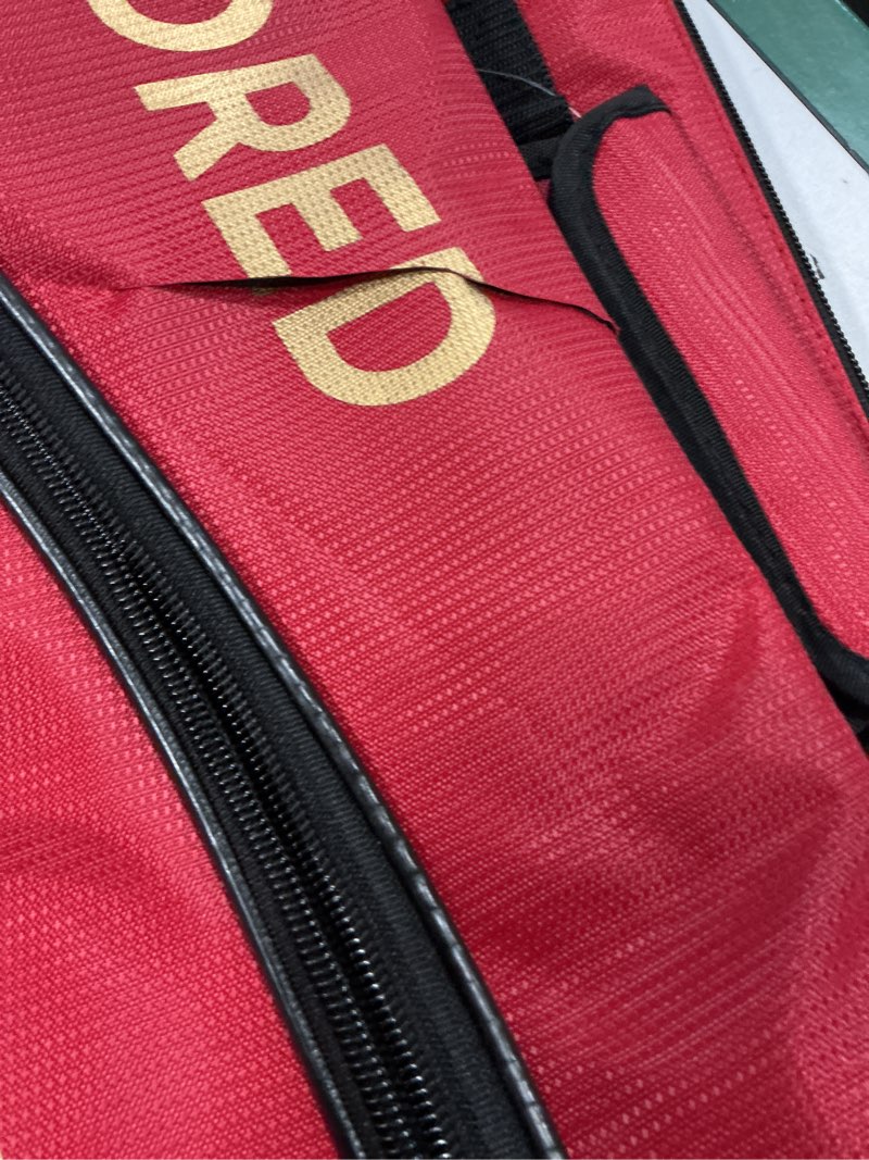 Condition photo showing As Is for hundred cosmogear badminton kit-bag (red, size: large) | double zipper | bag with front zipper pocket | material: polyester| padded back straps | easy-carry handle