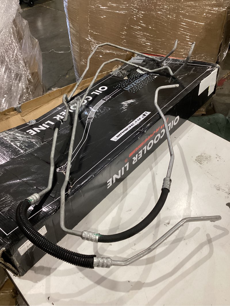 Condition photo showing As Is for oil cooler line apremium. compatibility unknown