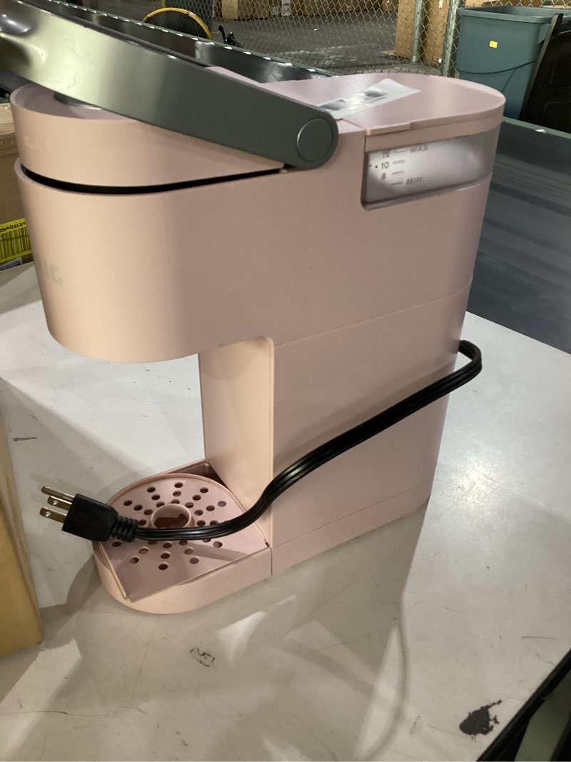 Condition photo showing As Is for *used* keurig k-mini single serve k-cup pod coffee maker, 6 to 12oz brew size, with cord storage, perfect for small spaces, dusty rose