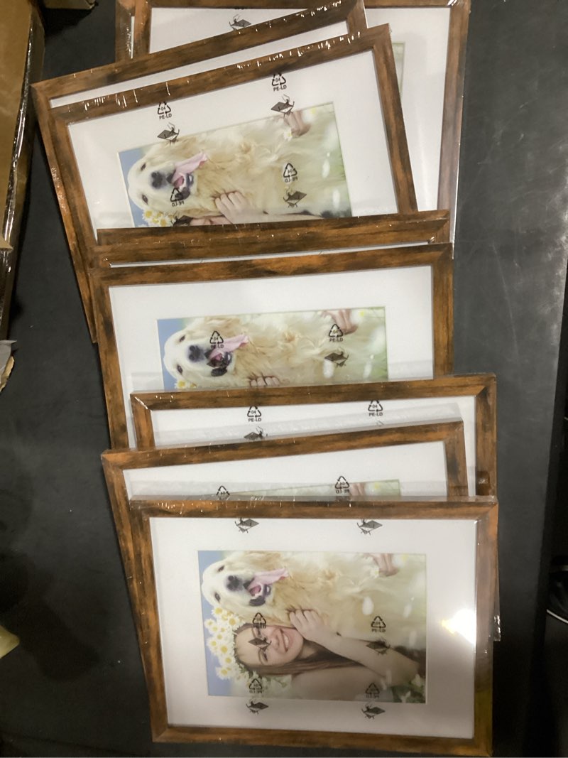 Condition photo showing New/Like New for decorUhome 8.5 by 11 Picture Frame Set of 10, Display Photos 6x8 with Mat or 8.5x11 Unmatted for Picture Frames Collage Wall Decor, Distressed Brown 8.5x11 Distressed Brown