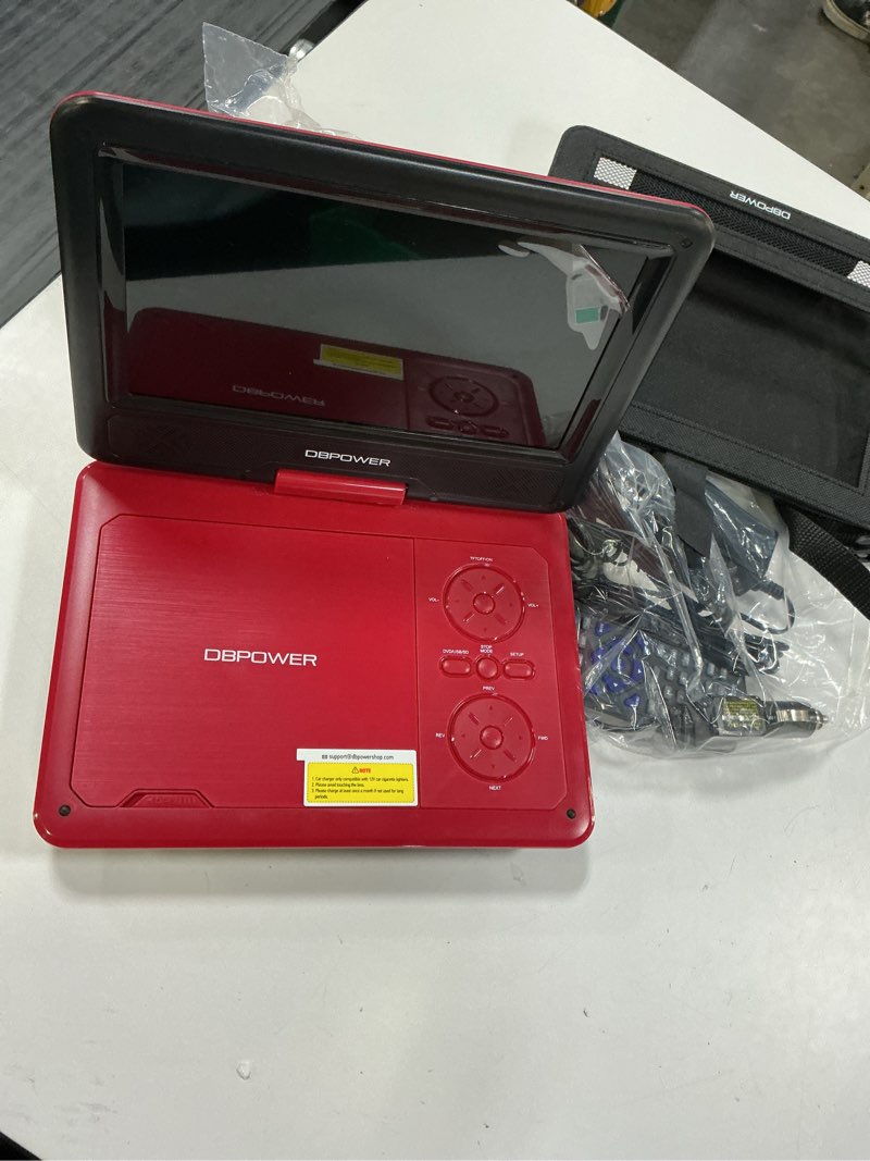 Condition photo showing Good Condition for DBPOWER 11.5" Portable DVD Player, 5-Hour Built-in Rechargeable Battery, 9" Swivel Screen, Support CD/DVD/SD Card/USB, Remote Control, 1.8 Meter Car Charger, Power Adaptor and Car Headrest (Red)