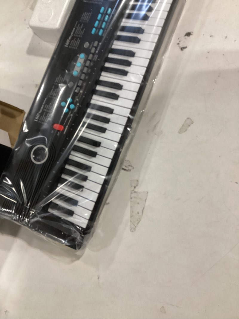 Condition photo showing Good Condition for 61 key keyboard Piano,Portable Electronic Digital Piano,Built In Dual Speakers,External Microphone,Power Plug,Rich Teaching Content,Multi-Functional Electronic Piano Suitable For Beginners kkek5 black