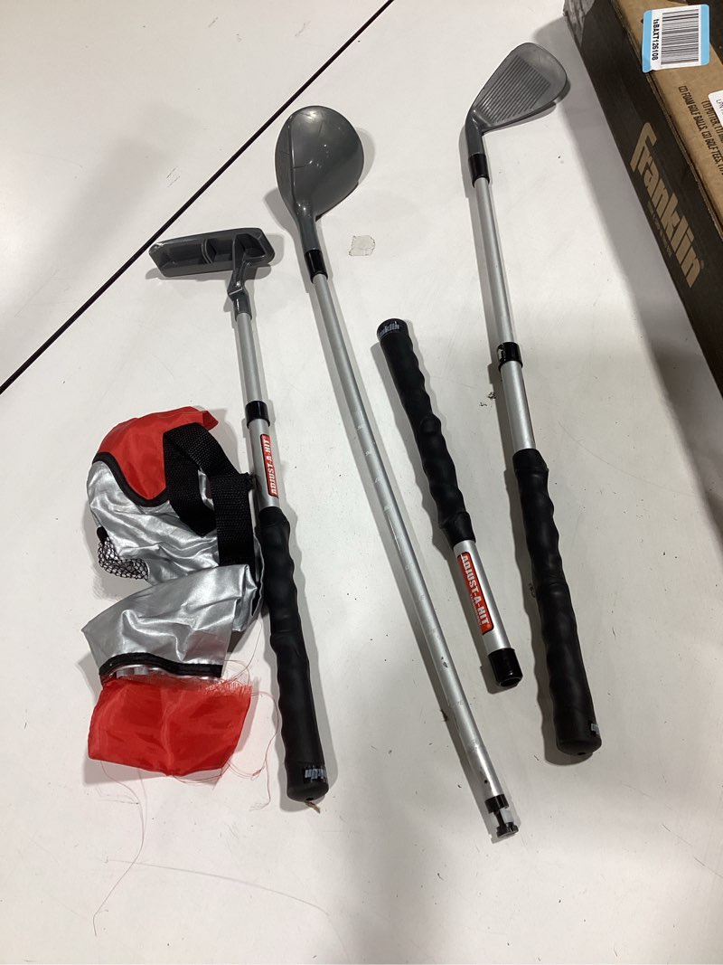 Condition photo showing As Is for franklin sports adjustable youth golf set red