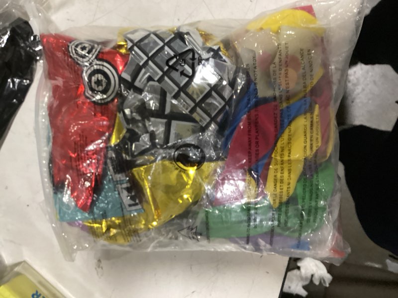 Condition photo showing As Is for premium 80s party decorations, back to the 80s birthday party decorations with fabric backdrop, tattoos, balloon garland, banner, table decor, photo props, cake toppers for birthday party, and more 80s retro