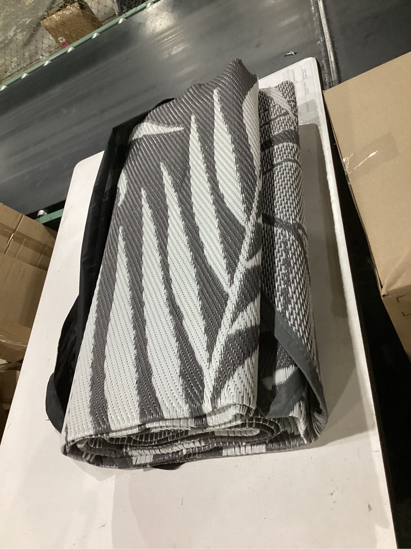 Condition photo showing Good Condition for genimo outdoor rug 5' x 8' waterproof for patios clearance, reversible plastic straw camping carpet, large area rugs mats for rv, picnic, backyard, deck, balcony, porch, beach, grey&white grey & white | waterproof 5' x 8' (rectangular)