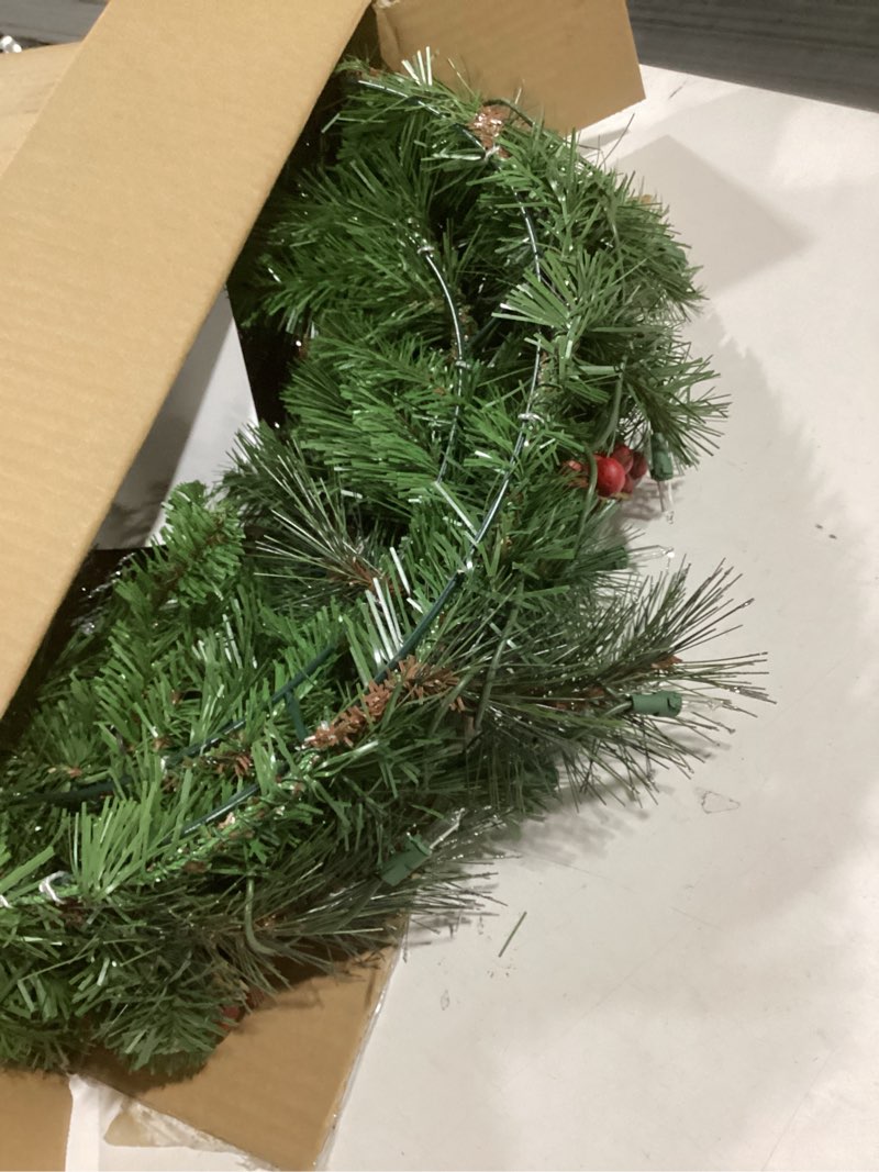 Condition photo showing Good Condition for National Tree Company 24 in Pre-Lit Crestwood Spruce Artificial Christmas Wreath, Christmas Decoration with Glitter, Pinecones, Red Berries, 50 Clear Lights, 160 Tips, Green 24 in Plug In Wreath