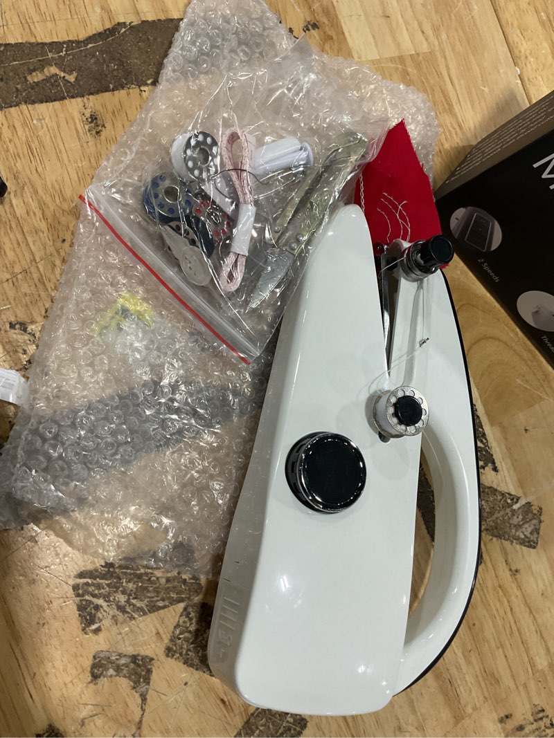 Condition photo showing As Is for handheld sewing machine,easy to use, electric sewing machine?fast sewing speed, easy sewing of clothes and fabrics, suitable for beginners diy white