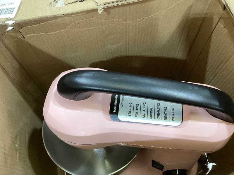 Condition photo showing As Is for hamilton beach electric stand mixer, 4 quarts, dough hook, flat beater attachments, splash guard, 7 speeds with whisk, easy-carry top handle, pink