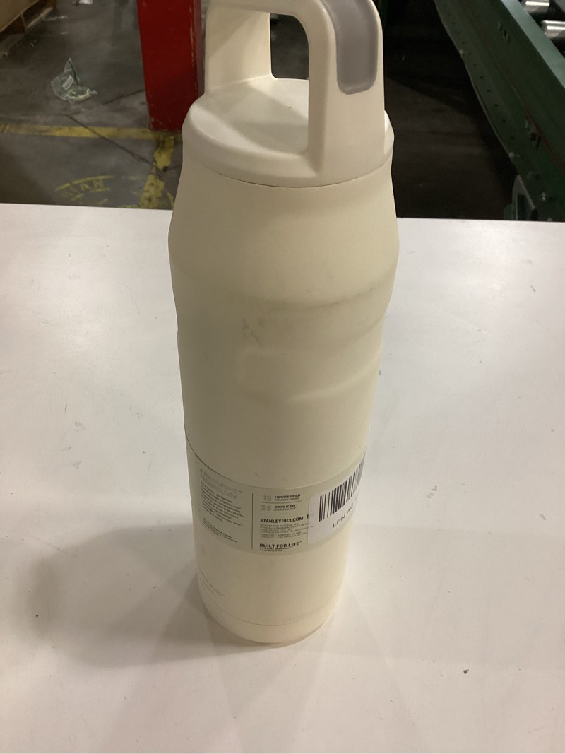 Condition photo showing New/Like New for Stanley IceFlow Cap and Carry Water Bottle | Wide Mouth Twist Lid | Lightweight & Leakproof for Travel & Sports | Insulated Stainless Steel | BPA-Free Cream Glimmer 36 Oz
