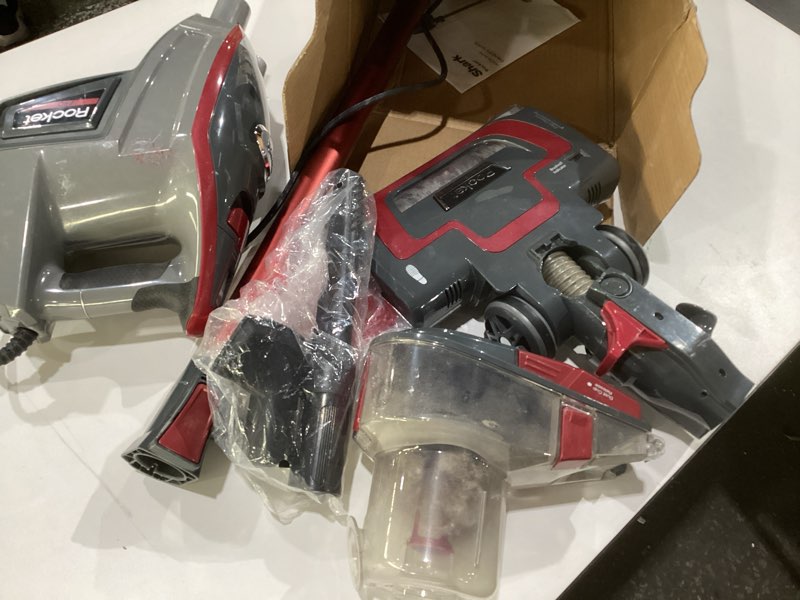 Condition photo showing As Is for Shark HV371 Rocket Pro DLX Corded Stick, Removable Hand Vacuum, Advanced Swivel Steering, XL Cup, Crevice Tool, Upholstery Tool & Anti-Allergen Dust Brush, Fuchsia, Capacity, USED/AS IS, NOT TESTED 