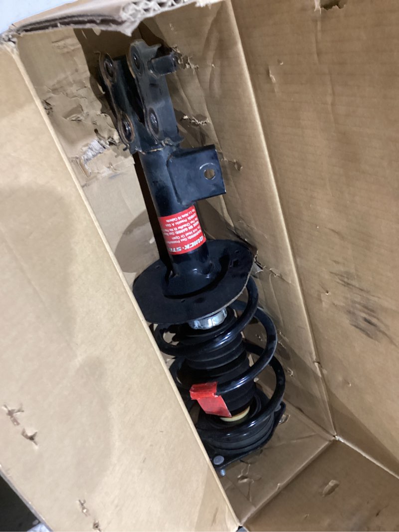 Condition photo showing As Is for monroe shocks & struts roadmatic 182587 strut and coil spring assembly