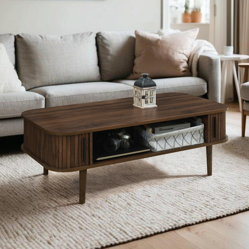 Winette 47.2" W Mid Century Coffee Table with Storage and Fluted Sliding Door