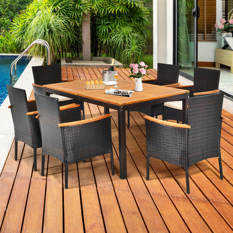 Nadkar 6 - Person Acacia Wicker Patio Dining Set with Rectangular Table , Cushions Included